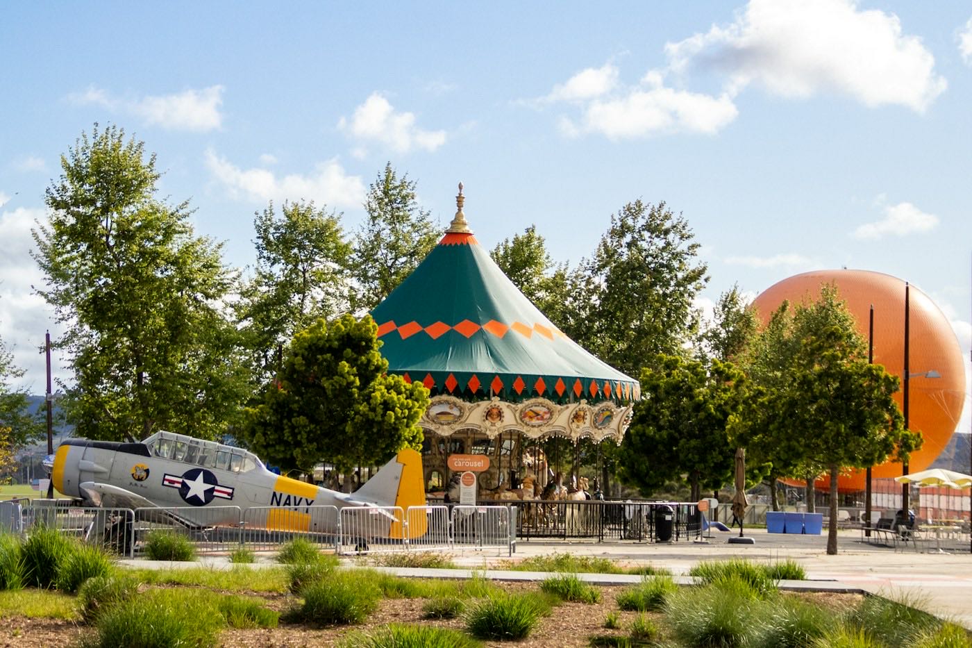 The orange Great Park balloon behind the carousel at Orange County Great Park