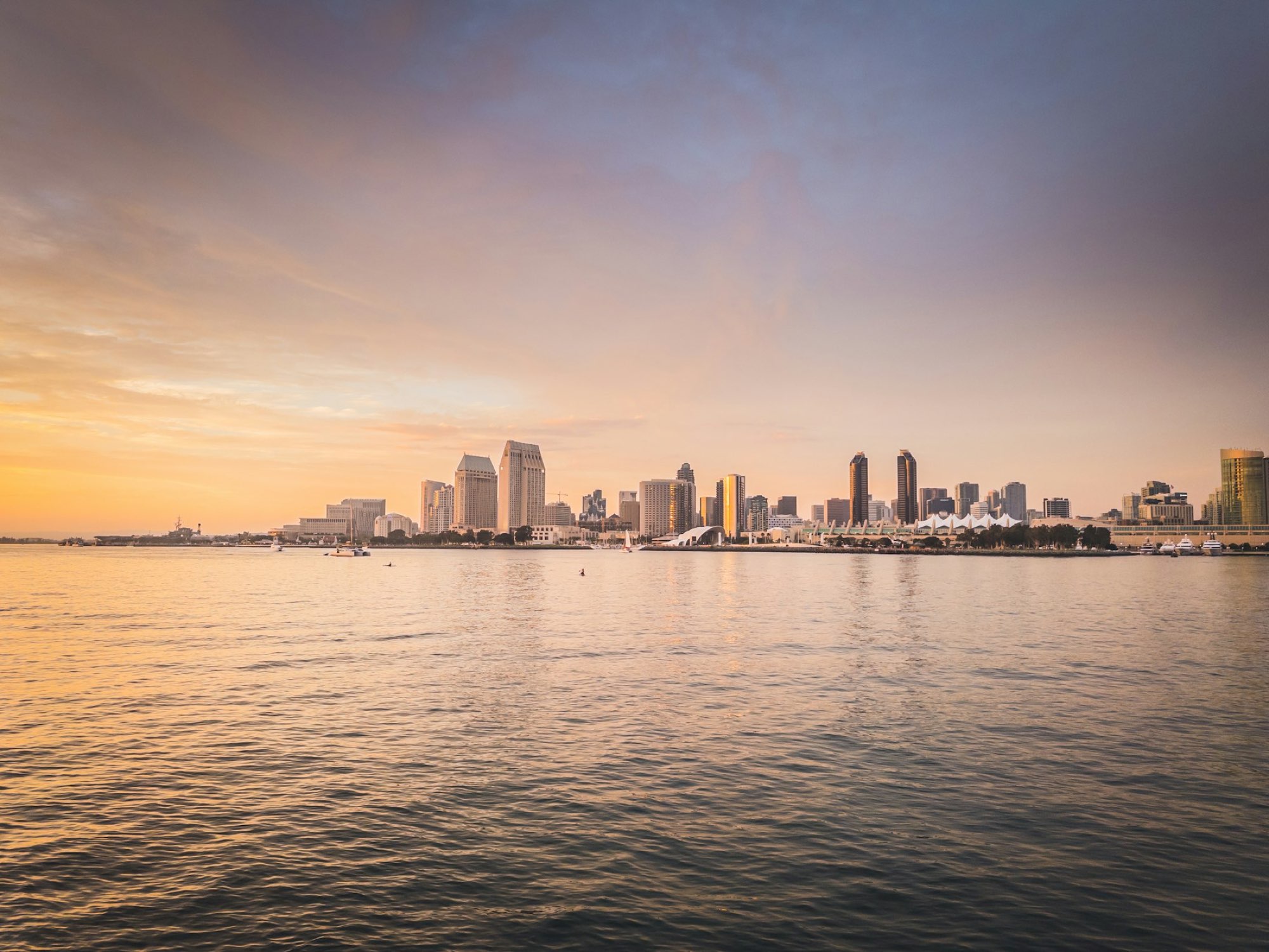 The downtown San Diego skyline across the bay at golden hour